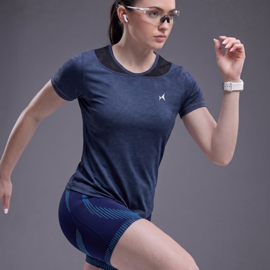 Woman in athletic wear with a gray background