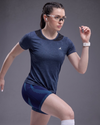 Woman in athletic wear with a gray background