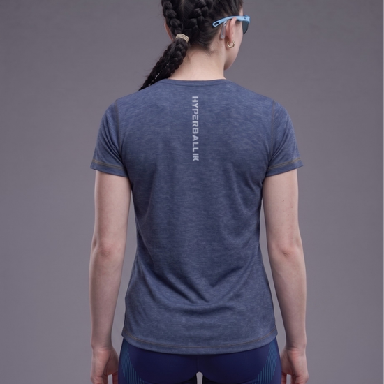 Person wearing a blue athletic shirt with 'HYPERBALL' branding on the back against a gray background