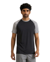 Man wearing a black and gray athletic shirt on a white background