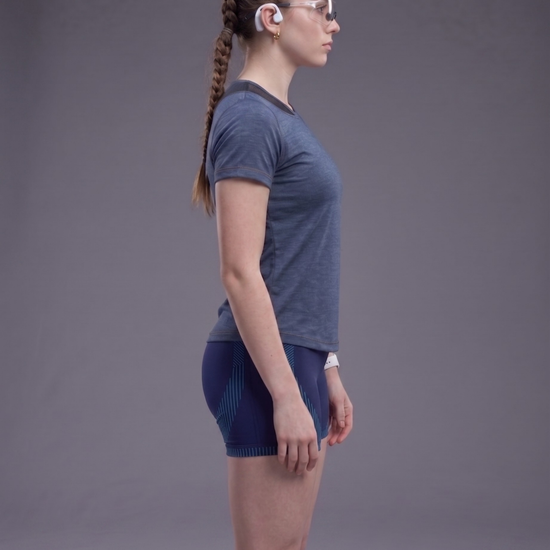 Person wearing a blue athletic outfit on a gray background