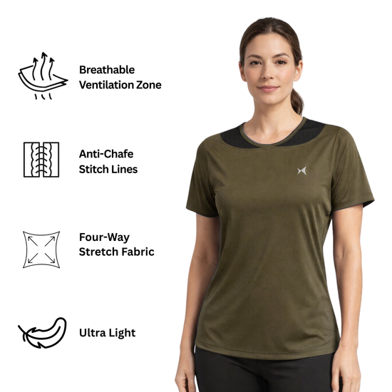 Woman wearing a green athletic shirt with a logo on a beige background