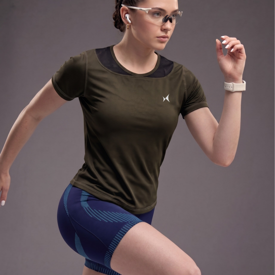 Woman in athletic wear with a dark background