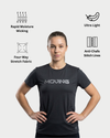 Woman wearing a black athletic shirt with features highlighted on a white background