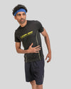 Man wearing a black athletic outfit with 'Limitless' branding on a gray background