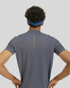 Person wearing a gray t-shirt with 'HYPERBALLER' branding on the back against a light gray background