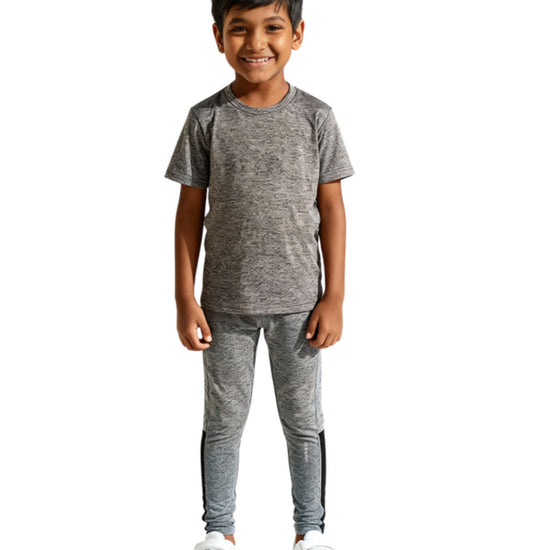 Child wearing the FunLuv kids set in grey, front view on a white background