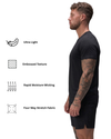 Man wearing a black t-shirt with fabric feature icons on a white background