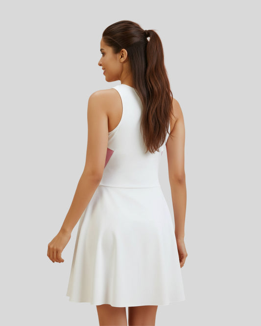 Woman wearing a white dress on a plain background