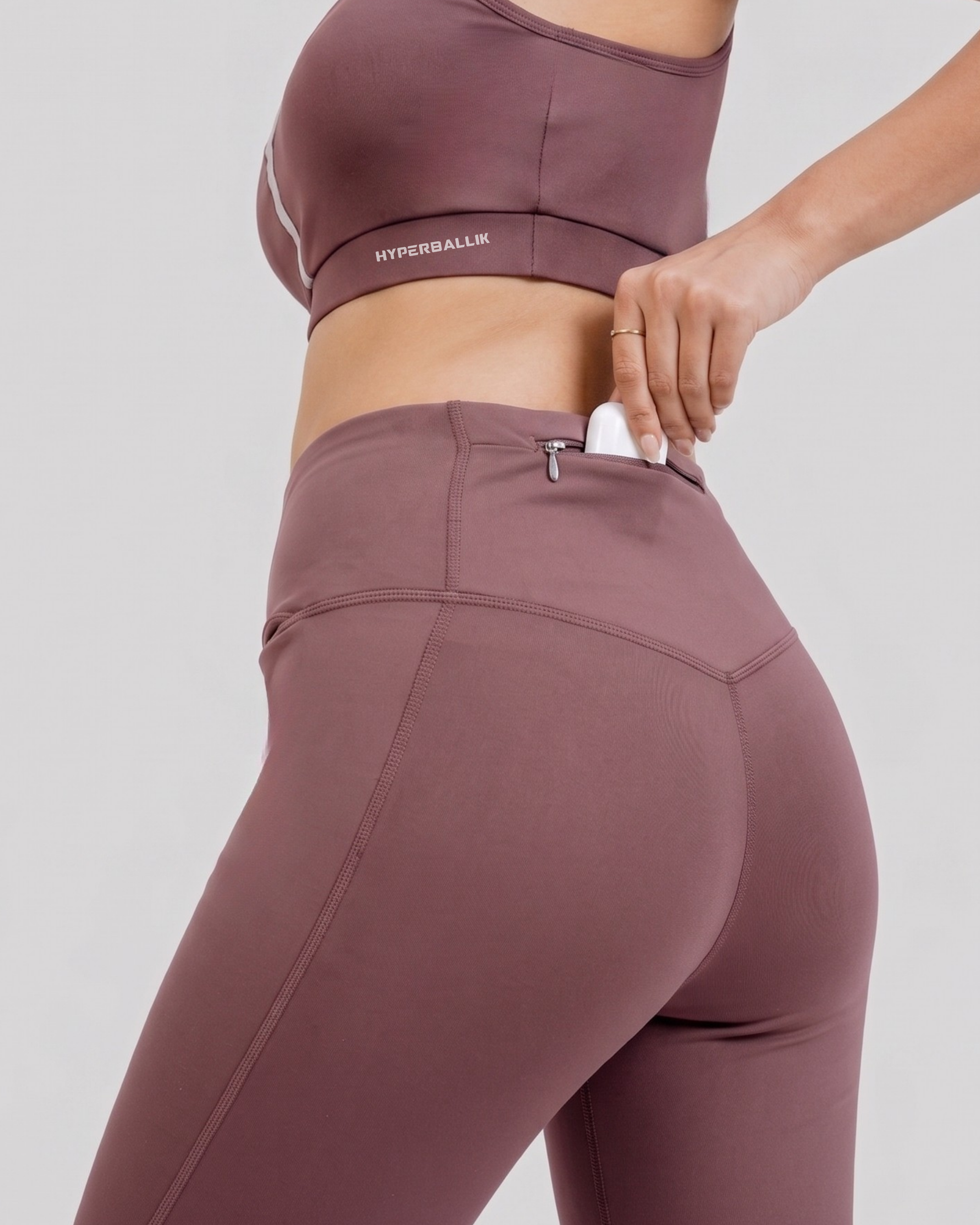 Women’s wine activewear tights back view