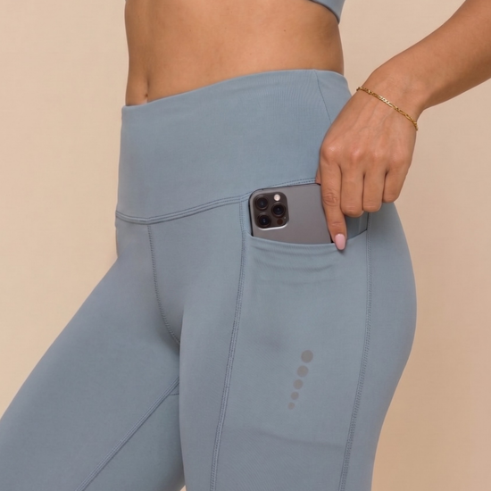 Petrol blue gym half tights side view for women