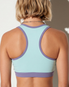 Women’s blue activewear tights back view