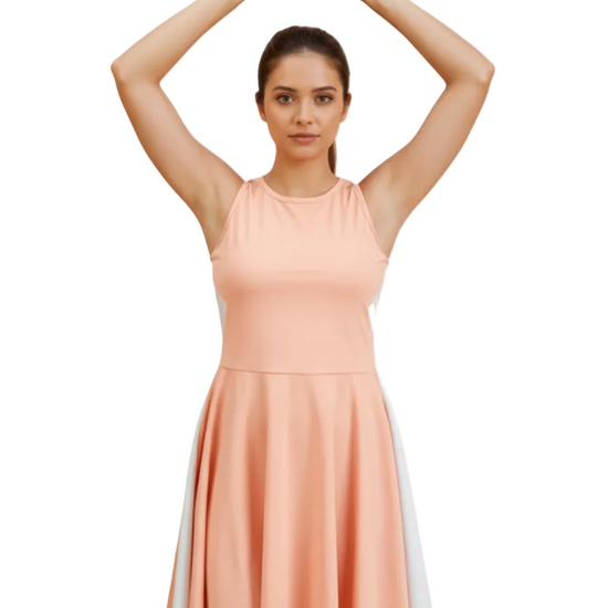 Woman wearing a peach dress with a white stripe on a white background