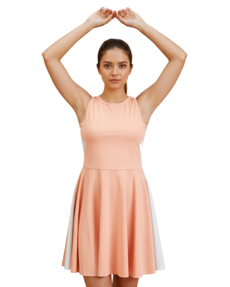 Woman wearing a peach dress with a white stripe on a white background