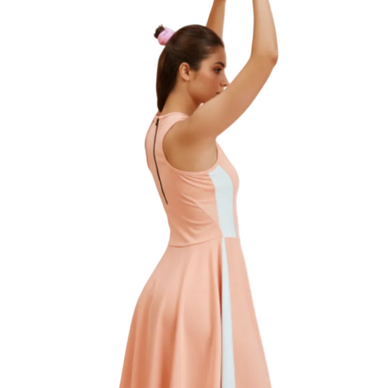 Woman wearing a peach dress with a white stripe on a white background