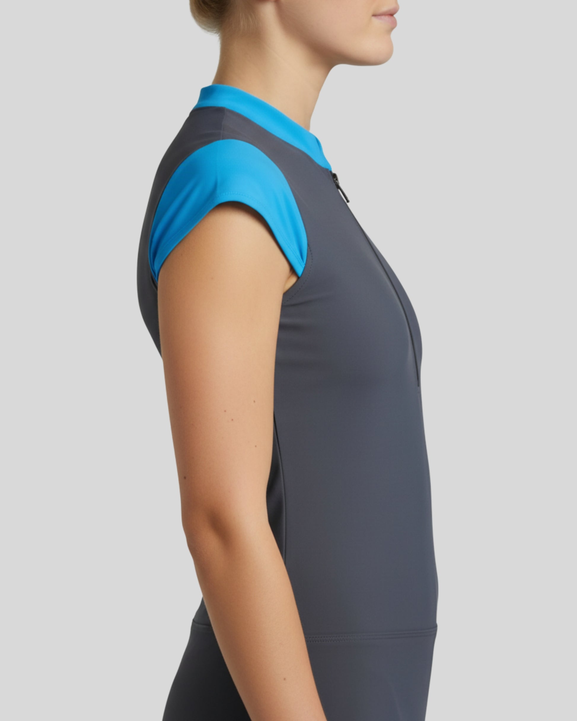 Gray athletic dress with blue sleeves on a plain background