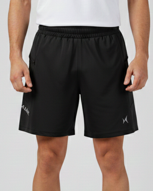 Black athletic shorts with a brand logo on a plain background