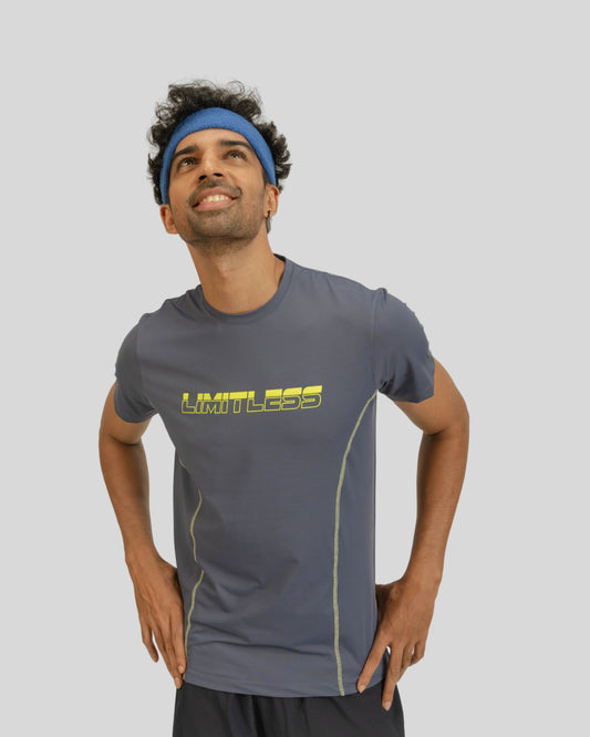 Man wearing a gray athletic shirt with yellow text on a light gray background
