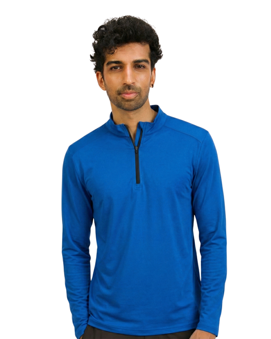Man wearing a blue long-sleeve shirt with a black zipper on a white background