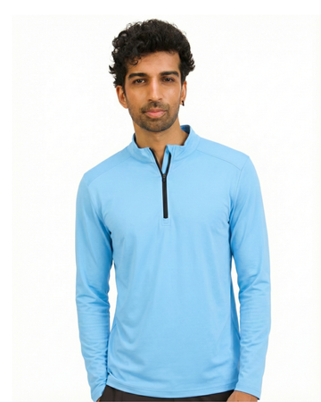 Man wearing a light blue long-sleeve shirt with a quarter zip on a white background