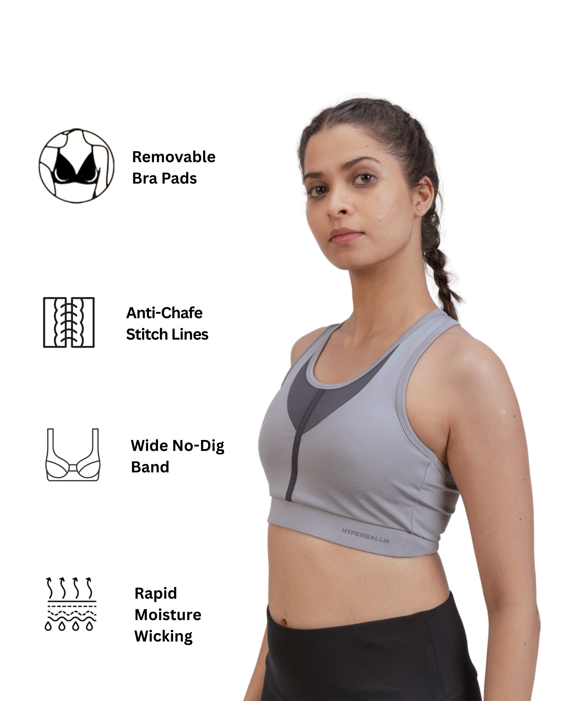 Woman wearing a gray sports bra with feature icons on a white background