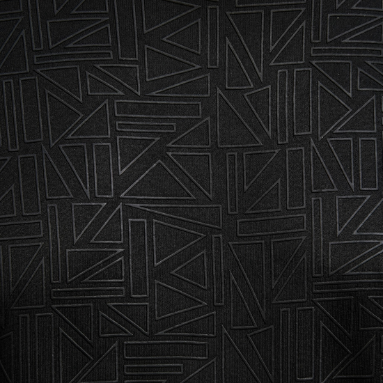 Black textured fabric with geometric pattern