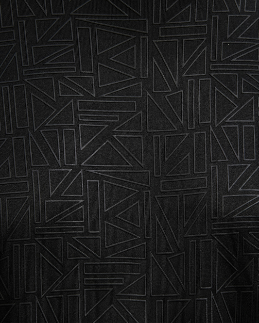 Black textured fabric with geometric pattern