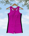 Pink and black swimsuit on a hanger against a blue sky background