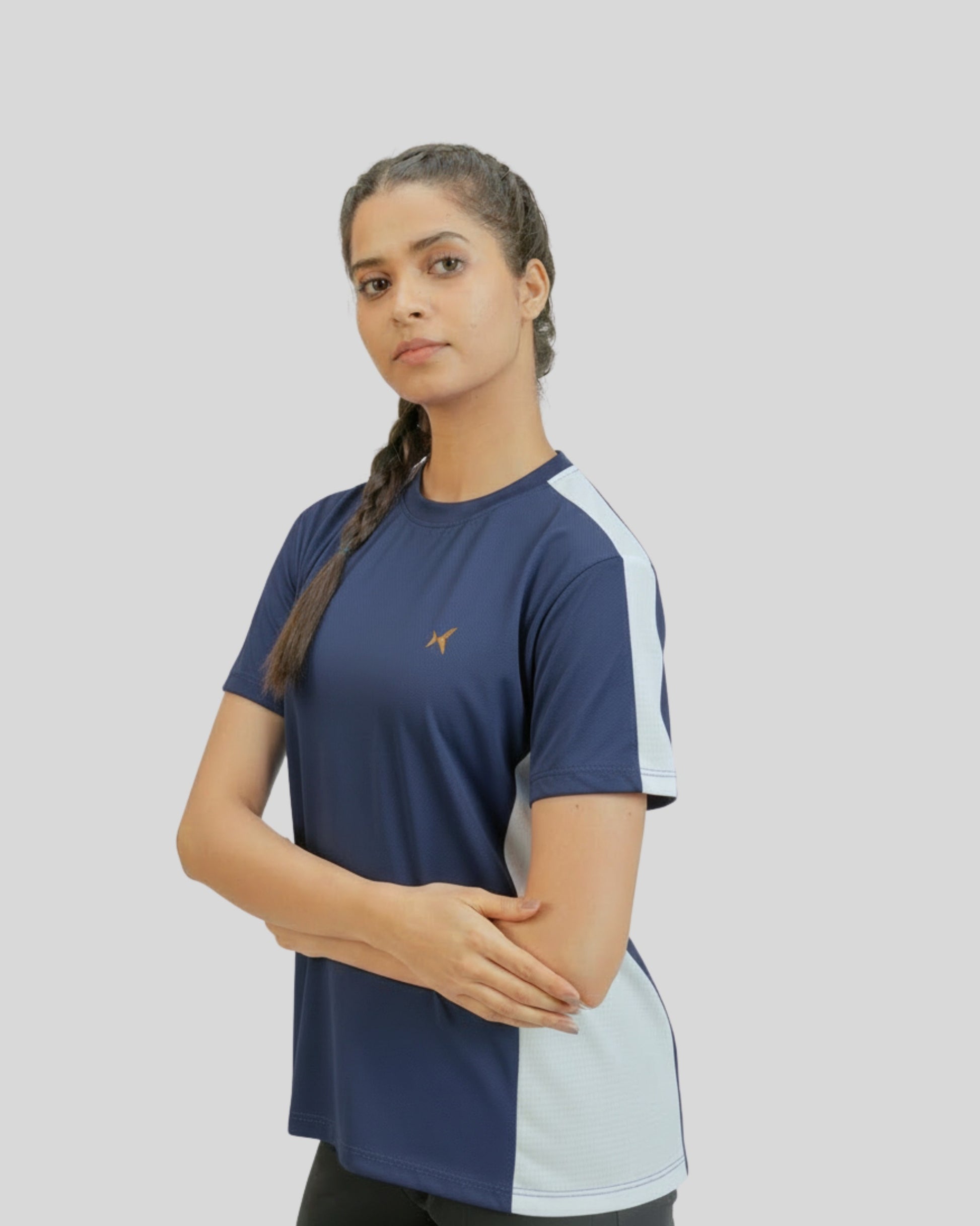 Woman wearing a blue and white athletic shirt on a plain background